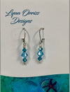 Lynn Orriss - Earrings - Blue crystal - 3 tiny beads