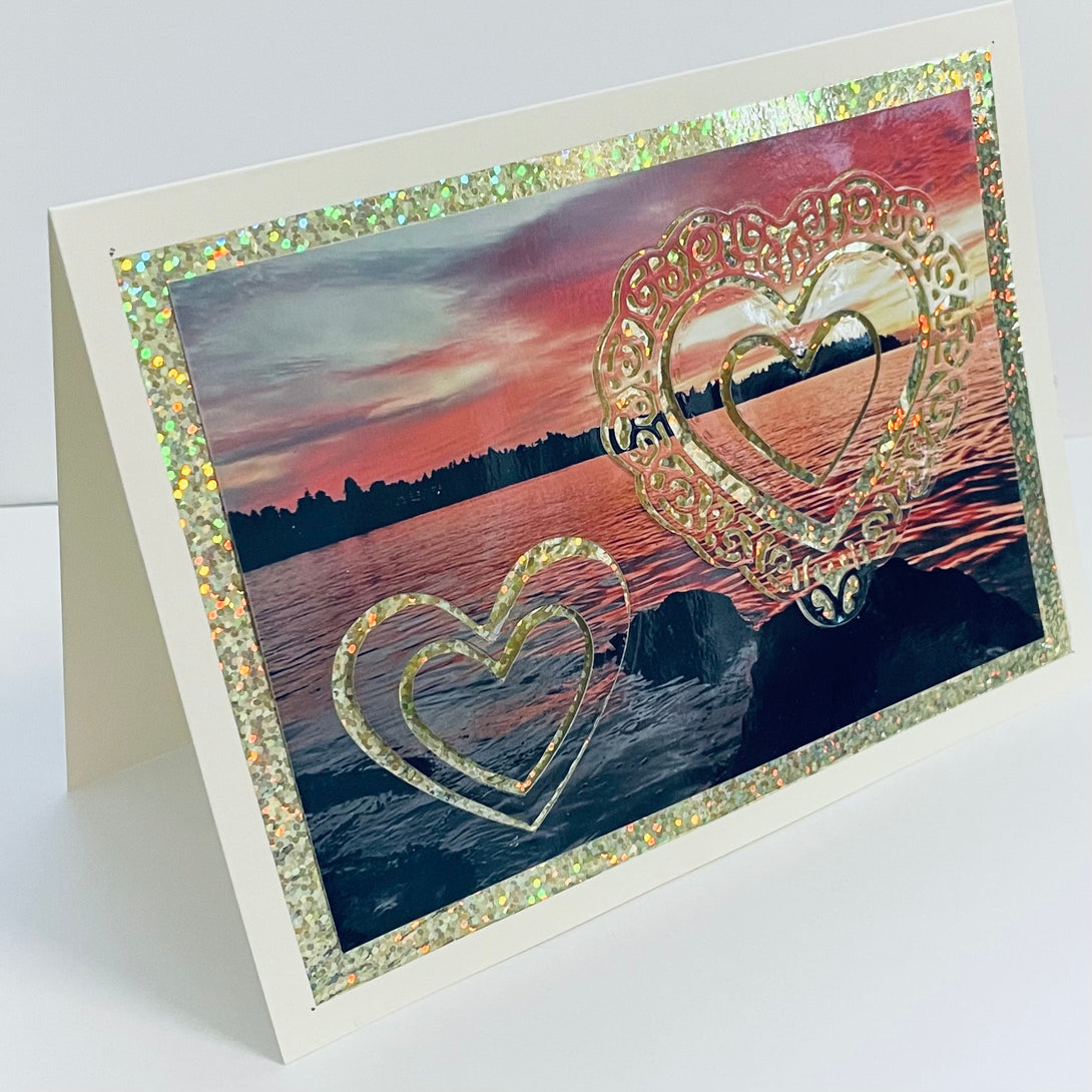 Jane Davidson - Card - Photo of sunset with gold hearts superimposed - Jane Davidson - McMillan Arts Centre Gallery, Gift Shop and Box Office - Vancouver Island Art Gallery