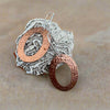 Laurie A. McDonald - Earrings - Textured Oval Hoops - Copper with sterling silver hooks