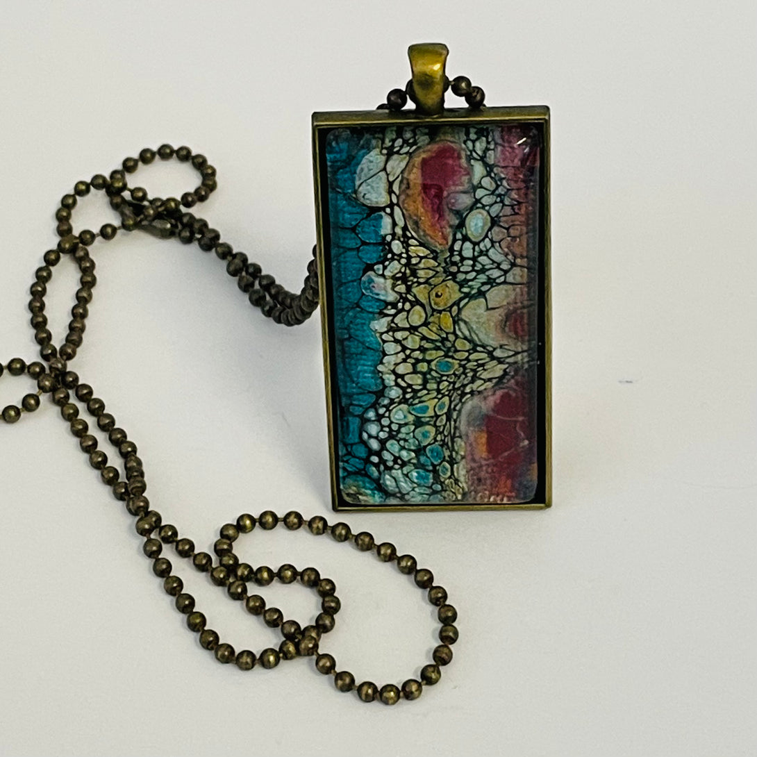 Linda Campbell -Pendant - Large Rectangle -blue pink, silver, on brass chain by Linda Campbell - McMillan Arts Centre - Vancouver Island Art Gallery