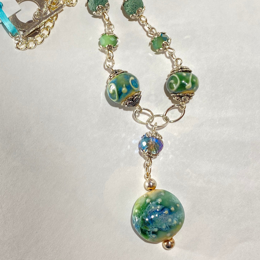 Mary Flores - Pendant Porcelain beads, crystals on silver plated chain & clasp by Mary Flores - McMillan Arts Centre - Vancouver Island Art Gallery