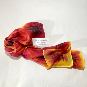 Kate Birch -Scarf - Handpainted silk - black design on red/yellow by Kate Birch - McMillan Arts Centre - Vancouver Island Art Gallery