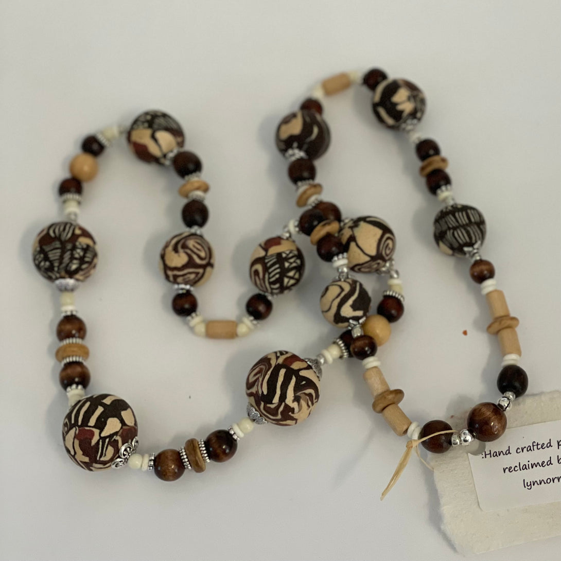Lynn Orriss - Necklace - Brown swirl beads mixed with wooden beads by Lynn Orriss - McMillan Arts Centre - Vancouver Island Art Gallery