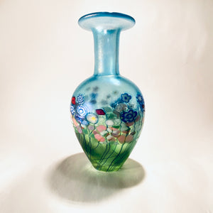 Robert Held - Blown Glass Vase in aqua with bed of flowers by Robert Held - McMillan Arts Centre - Vancouver Island Art Gallery