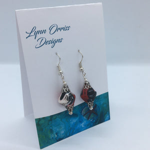 Lynn Orriss - Earrings - Oval, red, black white on silver hook by Lynn Orriss - McMillan Arts Centre - Vancouver Island Art Gallery